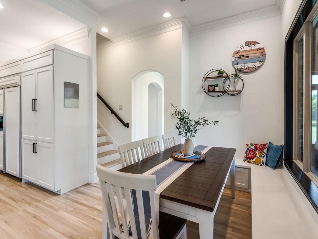 631 Deforest Court Coppell, TX 75019 - Photo 10 of 40 Breakfast area has a great bench with more storage for seating plenty and back stairway gives quick access to the kitchen for everyone.