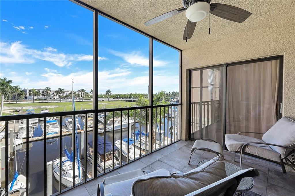 803 River Point Drive, Unit 201B Naples, FL 34102 - Photo 18 of 21 a balcony with furniture