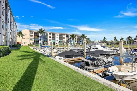 a view of a lake with couches and city view