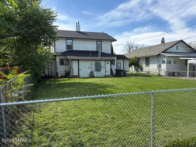 a view of a house with a yard and plants