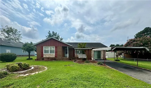 a front view of a house with a yard