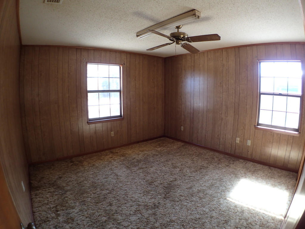 5326 Olin Merritt Street Baker, FL 32531 - Photo 4 of 9 a view of an empty room with a window