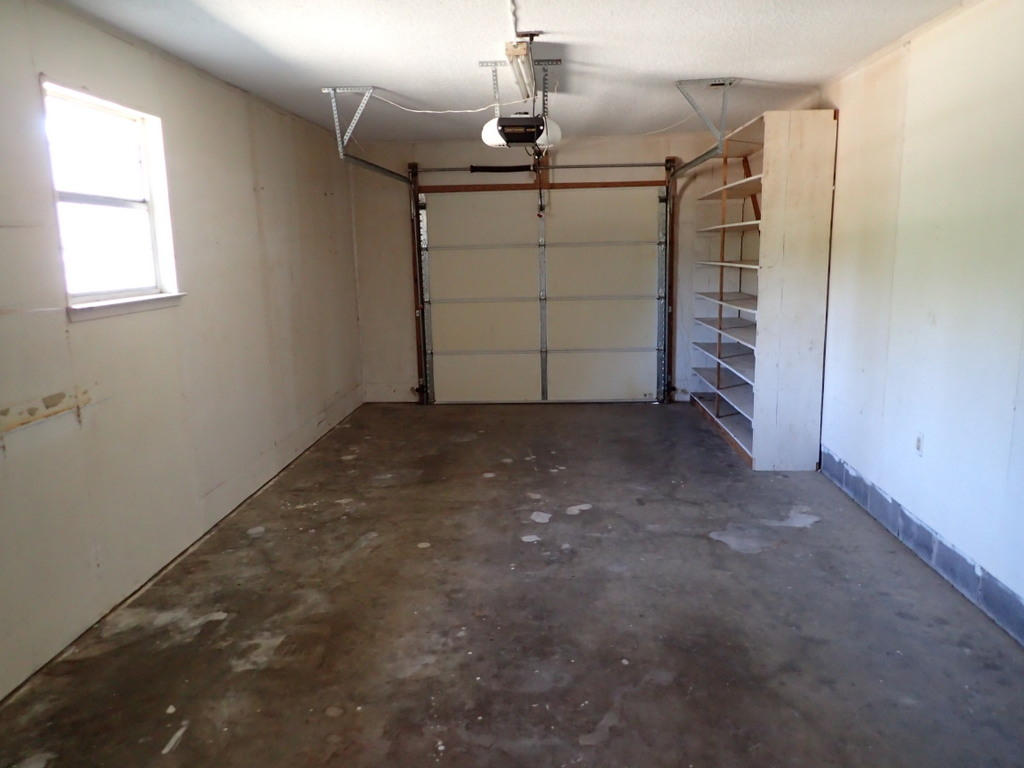 5326 Olin Merritt Street Baker, FL 32531 - Photo 7 of 9 a view of a garage