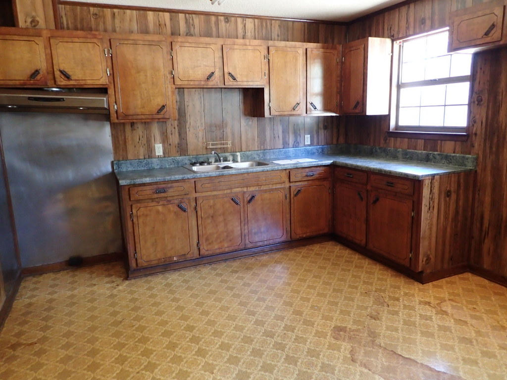 5326 Olin Merritt Street Baker, FL 32531 - Photo 8 of 9 a kitchen with granite countertop a sink cabinets and window