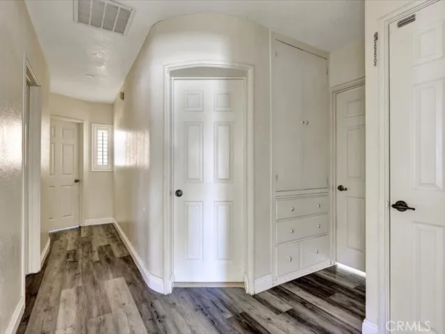 a view of a bathroom with wooden floor