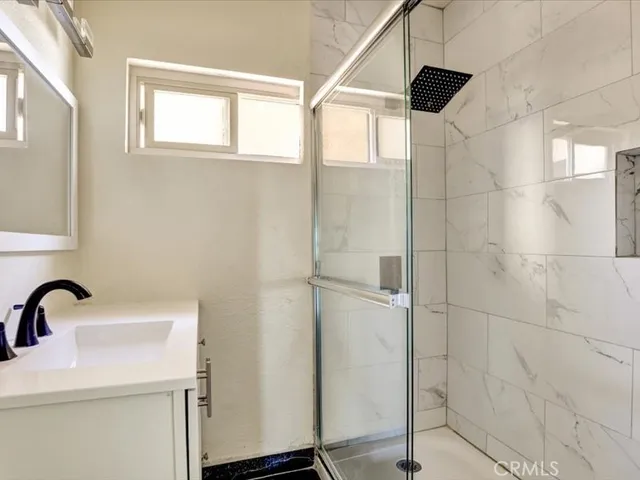 a bathroom with a sink and a shower