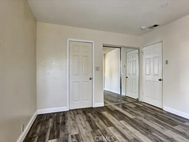 a view of room with window and ceiling fan