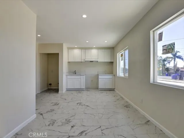a view of a hallway with closet and entryway