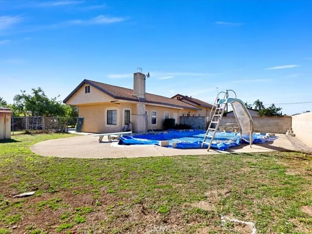 an aerial view of a residential houses with outdoor space