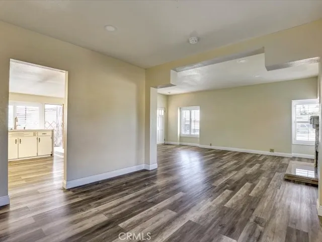 a view of an empty room and glass door