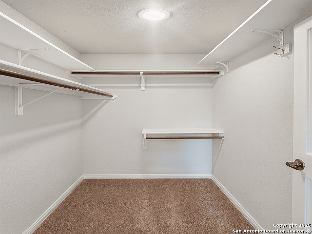3831 Key W Way Converse, TX 78109 - Photo 9 of 18 a view of an empty walk in closet