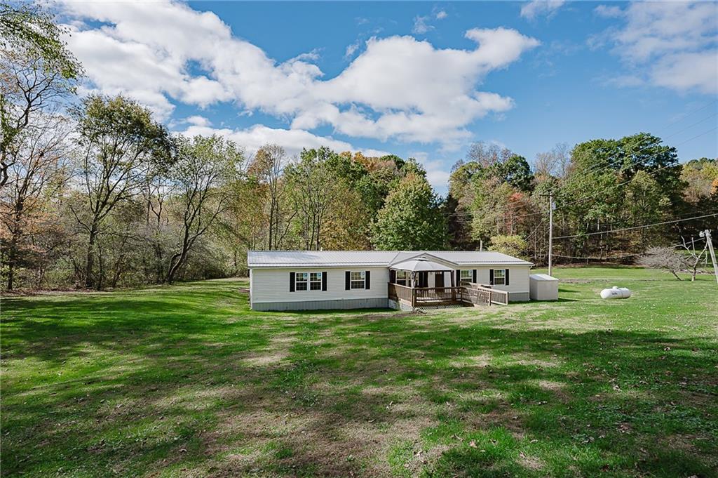155 Baker Road Worthington, PA 16262 - Photo 2 of 50 a view of a house with garden and trees