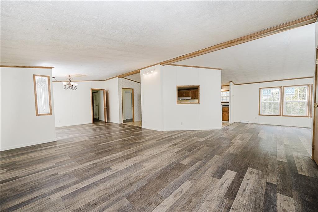 155 Baker Road Worthington, PA 16262 - Photo 27 of 50 a view of empty room with wooden floor and fan