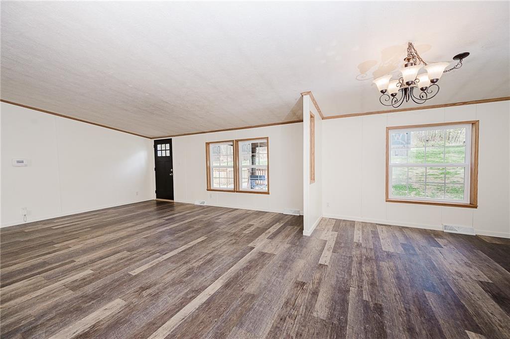 155 Baker Road Worthington, PA 16262 - Photo 29 of 50 a view of an empty room with wooden floor and a window