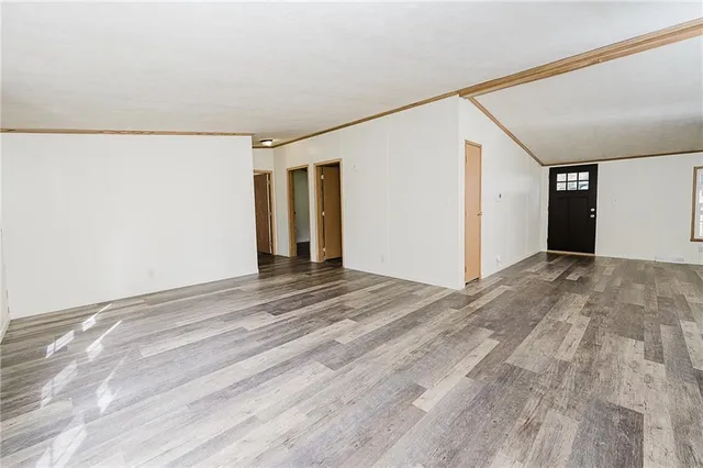 a kitchen with granite countertop a refrigerator and a sink
