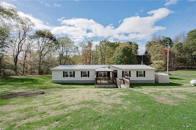 a view of a house with a big yard
