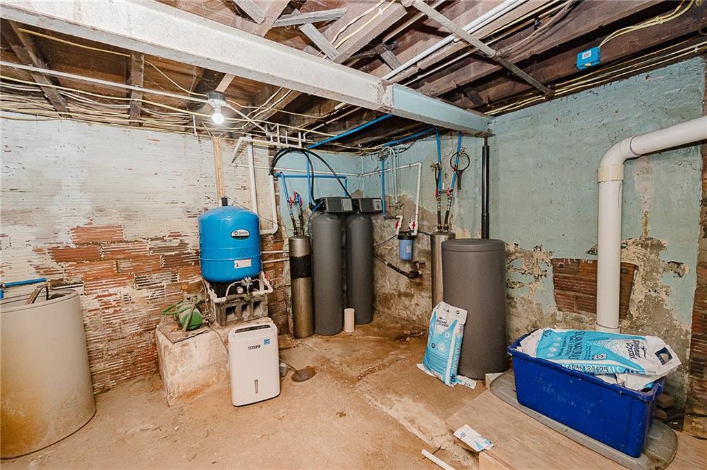 155 Baker Road Worthington, PA 16262 - Photo 48 of 50 a view of a storage room with water heater and racks