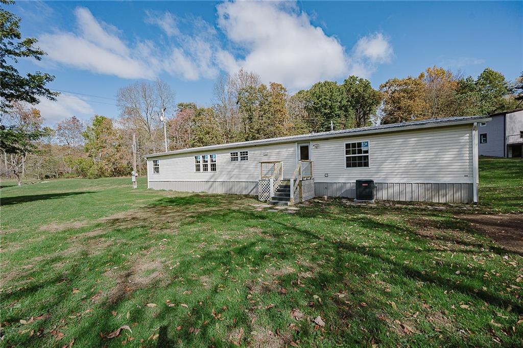 155 Baker Road Worthington, PA 16262 - Photo 8 of 50 a view of a backyard with plants and a big yard