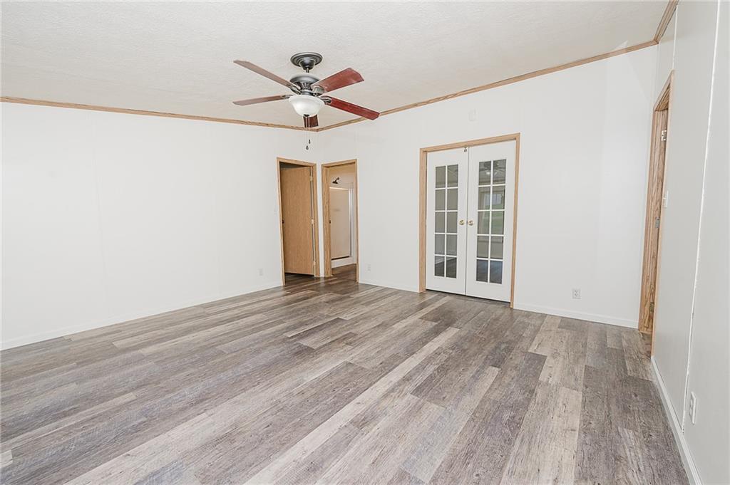 155 Baker Road Worthington, PA 16262 - Photo 10 of 50 a view of an empty room with a window and wooden floor