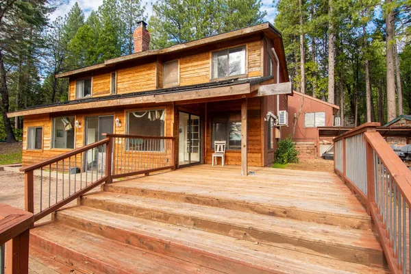 a view of a wooden door with an outdoor space