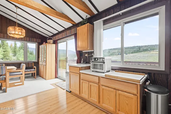 a kitchen that has a sink stove and cabinets