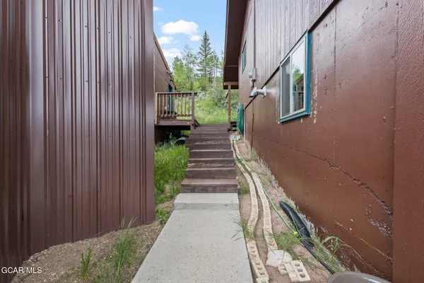 a view of a pathway besides a house