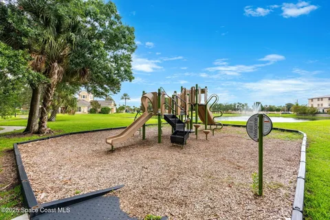 a view of a yard with a wooden fence