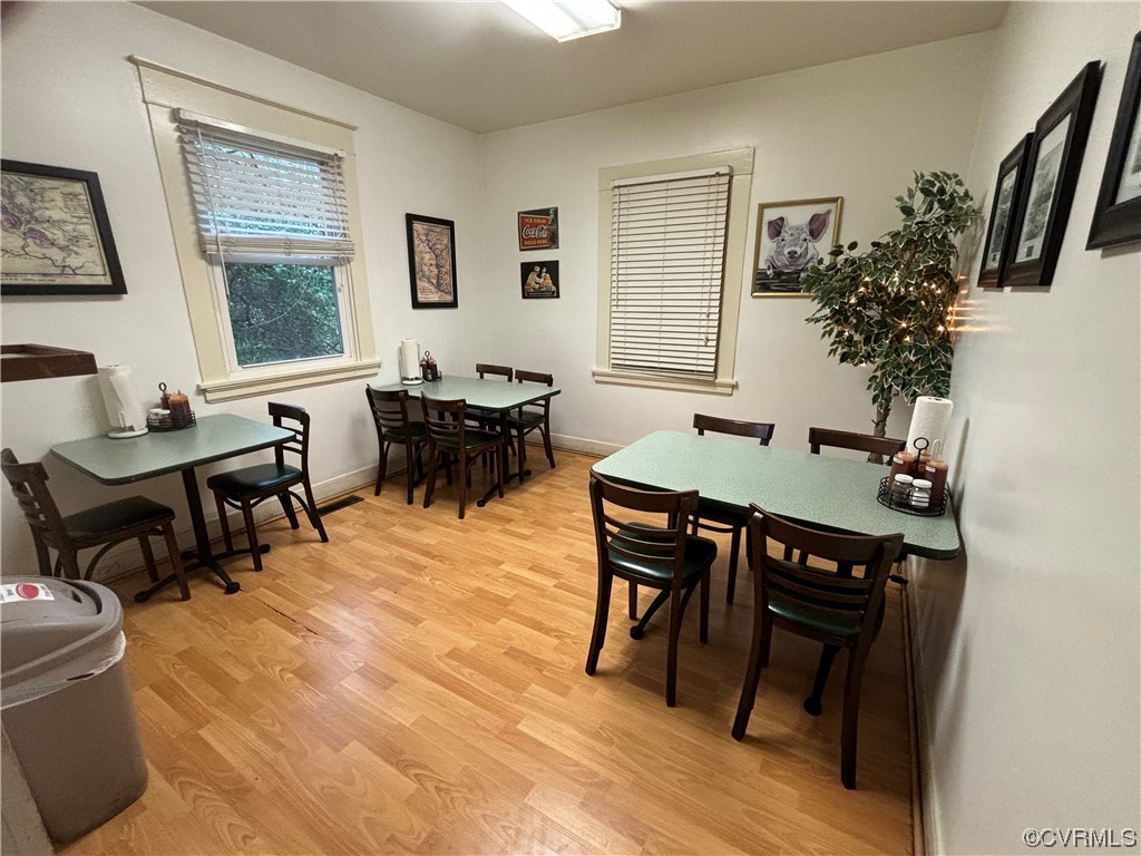 8011 Cold Harbor Road Mechanicsville, VA 23111 - Photo 17 of 20 a view of a dining room with furniture window and wooden floor