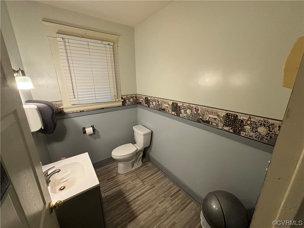 8011 Cold Harbor Road Mechanicsville, VA 23111 - Photo 18 of 20 a bathroom with a toilet a sink and a window