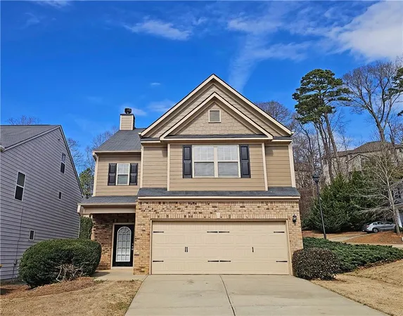 a front view of a house with a garage