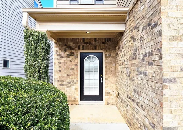 a front view of a house with large windows