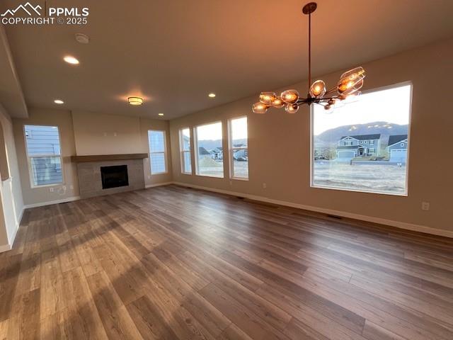 17570 Cerberus Court Monument, CO 80132 - Photo 4 of 15 a view of a room with wooden floor fireplace and windows