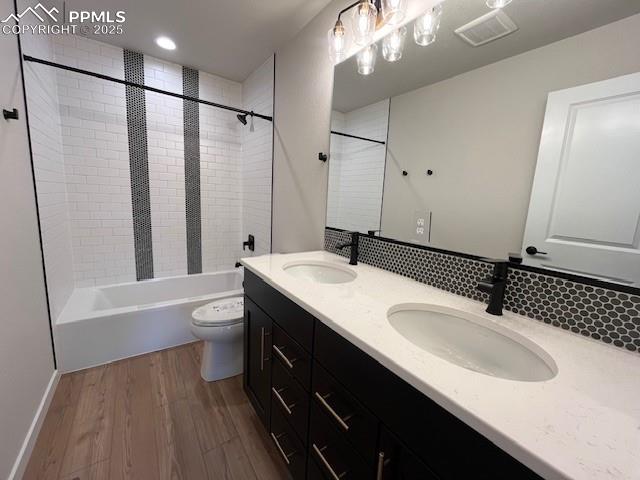 17570 Cerberus Court Monument, CO 80132 - Photo 10 of 15 a bathroom with a double vanity sink mirror double and toilet