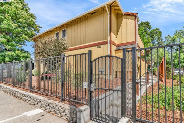 a view of a house with a small garden