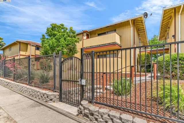 a view of a wrought iron fences in front of house