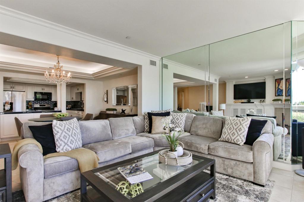 1099 1st Street, Unit 119 Coronado, CA 92118 - Photo 14 of 22 a living room with furniture and a flat screen tv