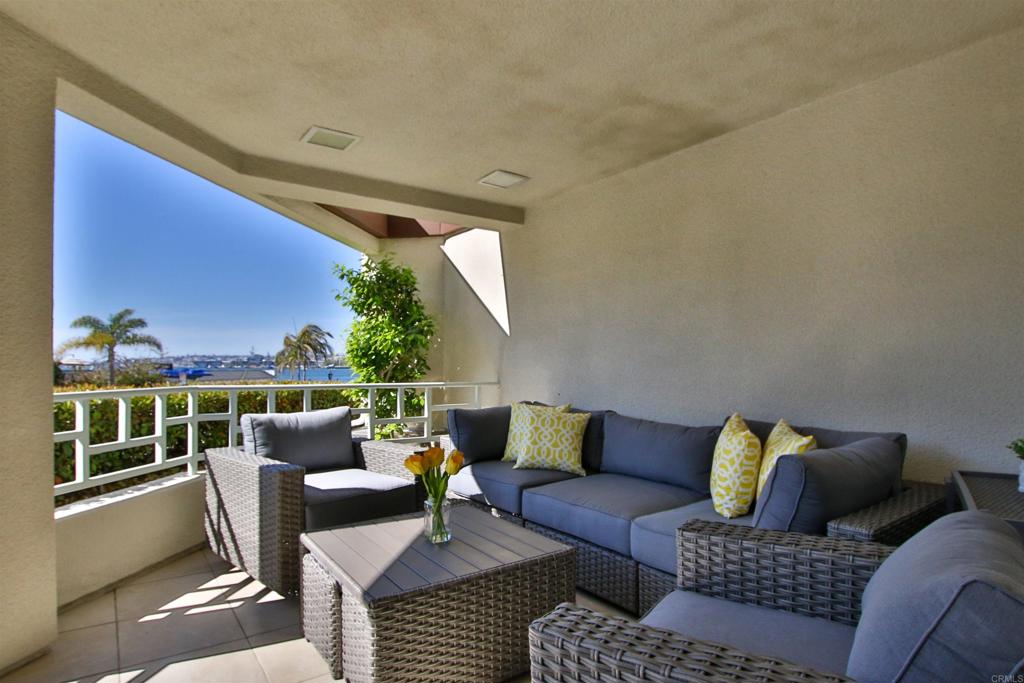 1099 1st Street, Unit 119 Coronado, CA 92118 - Photo 20 of 22 a outdoor living room with furniture and a floor to ceiling window