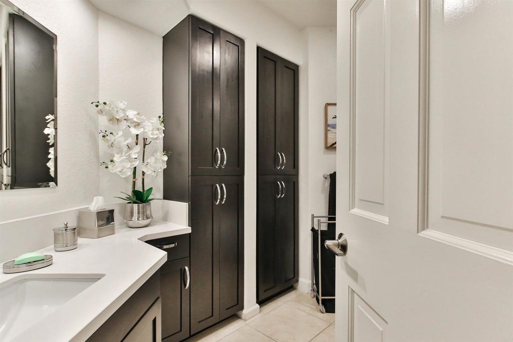 1099 1st Street, Unit 119 Coronado, CA 92118 - Photo 2 of 22 a bathroom with a sink and a mirror