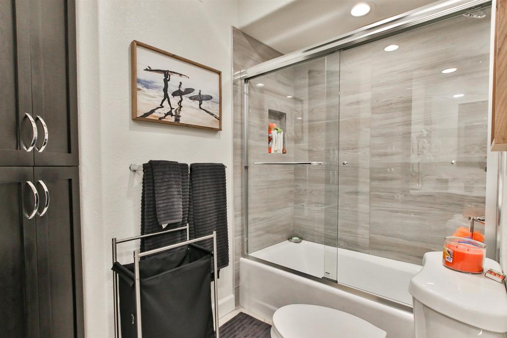 1099 1st Street, Unit 119 Coronado, CA 92118 - Photo 3 of 22 a bathroom with a toilet and a bathtub