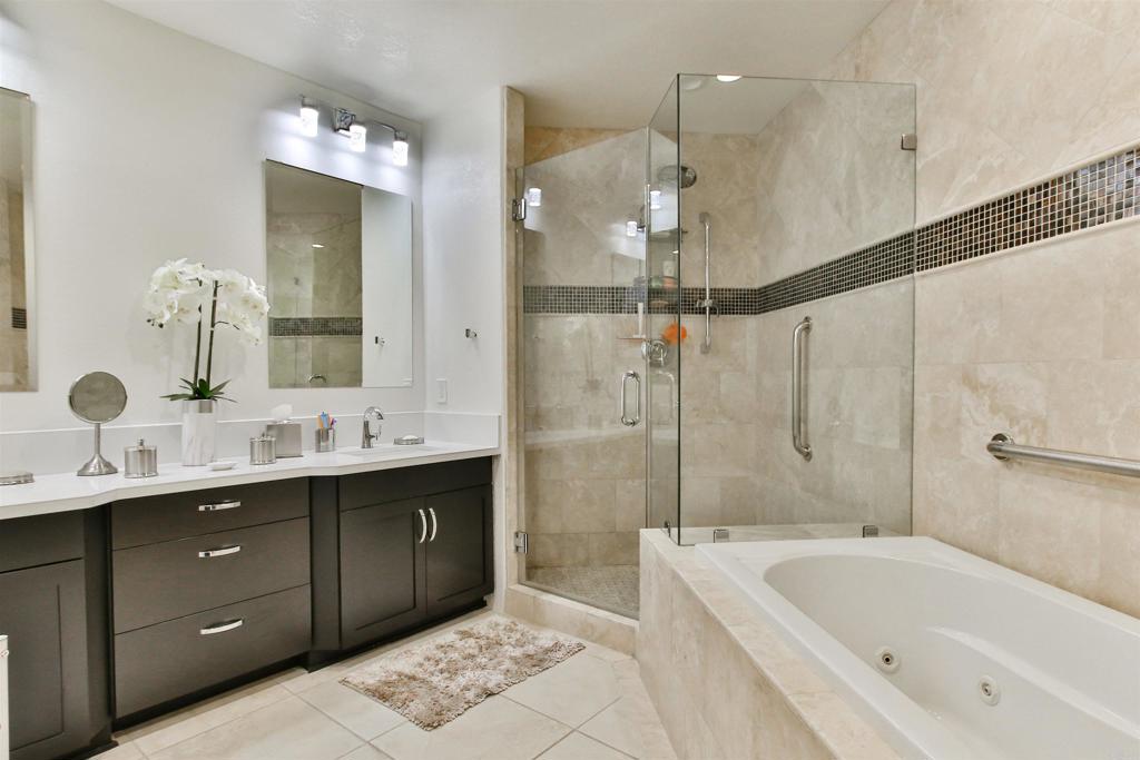 1099 1st Street, Unit 119 Coronado, CA 92118 - Photo 6 of 22 a bathroom with a tub sink shower and mirror
