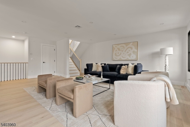 112 Valley Road, Unit A Montclair, NJ 07042 - Photo 3 of 20 a living room with furniture and wooden floor