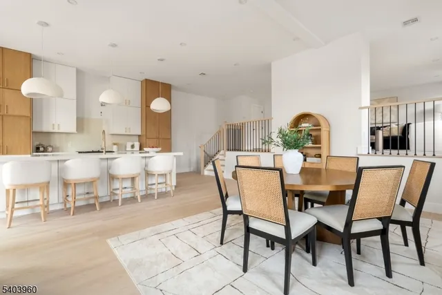 a view of a dining room with furniture and window