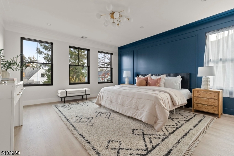 112 Valley Road, Unit A Montclair, NJ 07042 - Photo 6 of 20 a spacious bedroom with a bed and large windows