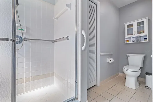 a bathroom with a toilet and shower
