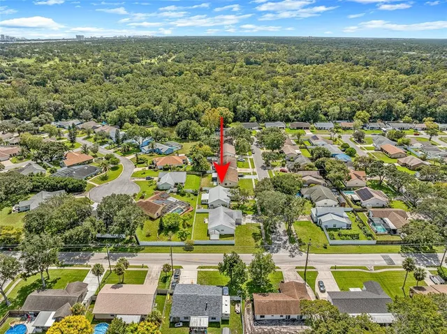 an aerial view of residential building and lake