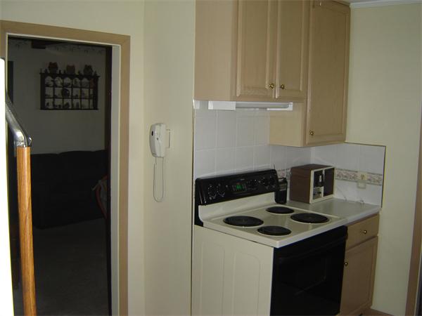 182 Riverton Road Springfield, MA 01109 - Photo 3 of 14 a kitchen with a stove and cabinets