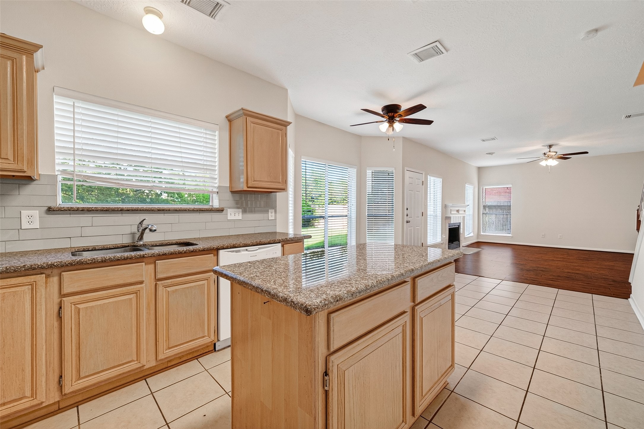 4539 Springfield Lakes Street Sugar Land, TX 77479 - Photo 12 of 34 a kitchen with stainless steel appliances granite countertop a sink a counter top space and a window