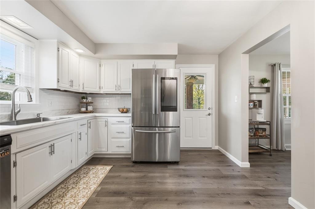 129 Meadowbrook Road Renfrew, PA 16053 - Photo 5 of 45 a kitchen with a refrigerator stove and wooden cabinets