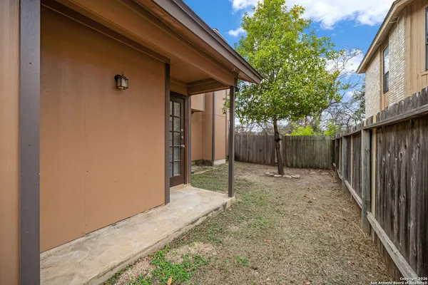 a view of a house with a tree