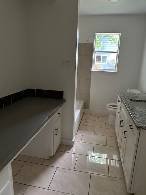 910 1/2 Oak Street Houston, TX 77018 - Photo 12 of 13 a kitchen with a cabinets and washing machine